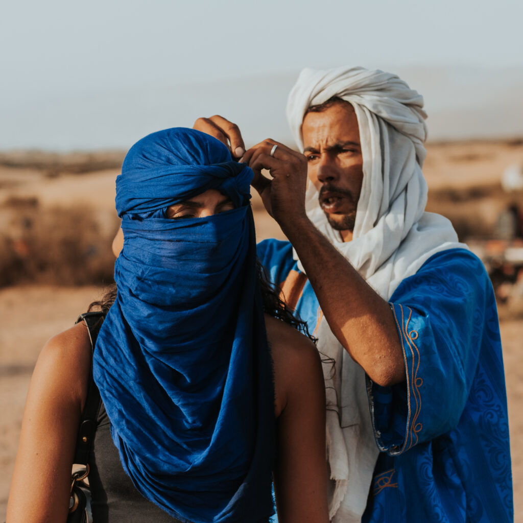 Camel ride in Agadir desert Timlalin dunes at sunset Morocco